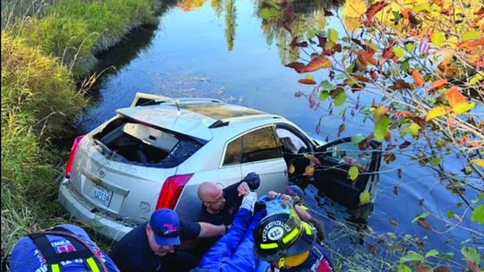 Hay bale causes car to end up in water