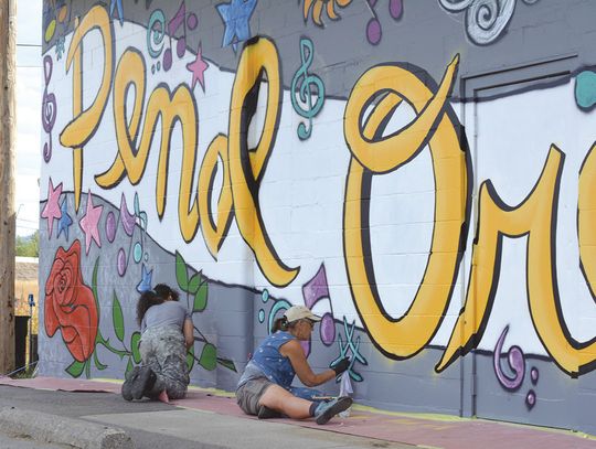 Creative District puts mural on Playhouse