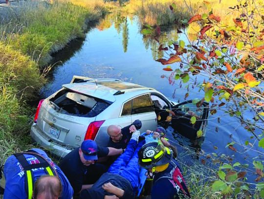 Hay bale causes car to end up in water